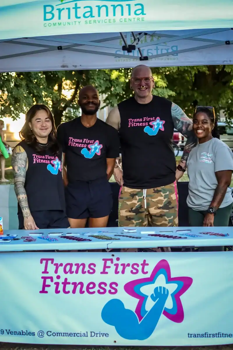 Trans First Fitness team at community event under Britannia Community Services Centre tent.