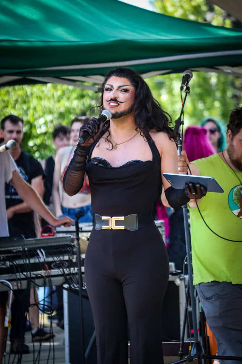 Performer with makeup and costume at outdoor event in Canada.