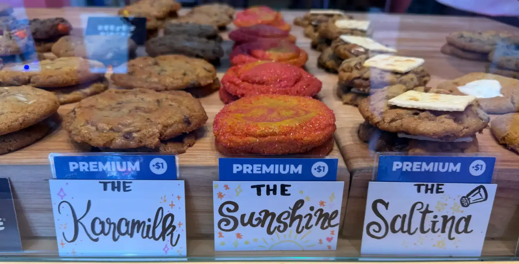Assorted cookies displayed with labels at Now Canada bakery.