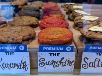 Assorted cookies displayed with labels at Now Canada bakery.